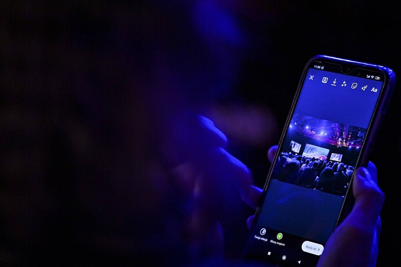 4 November 2021; Attendee uses phone during day three of Web Summit 2021 at the Altice Arena in Lisbon, Portugal. Photo by Eóin Noonan/Web Summit via Sportsfile